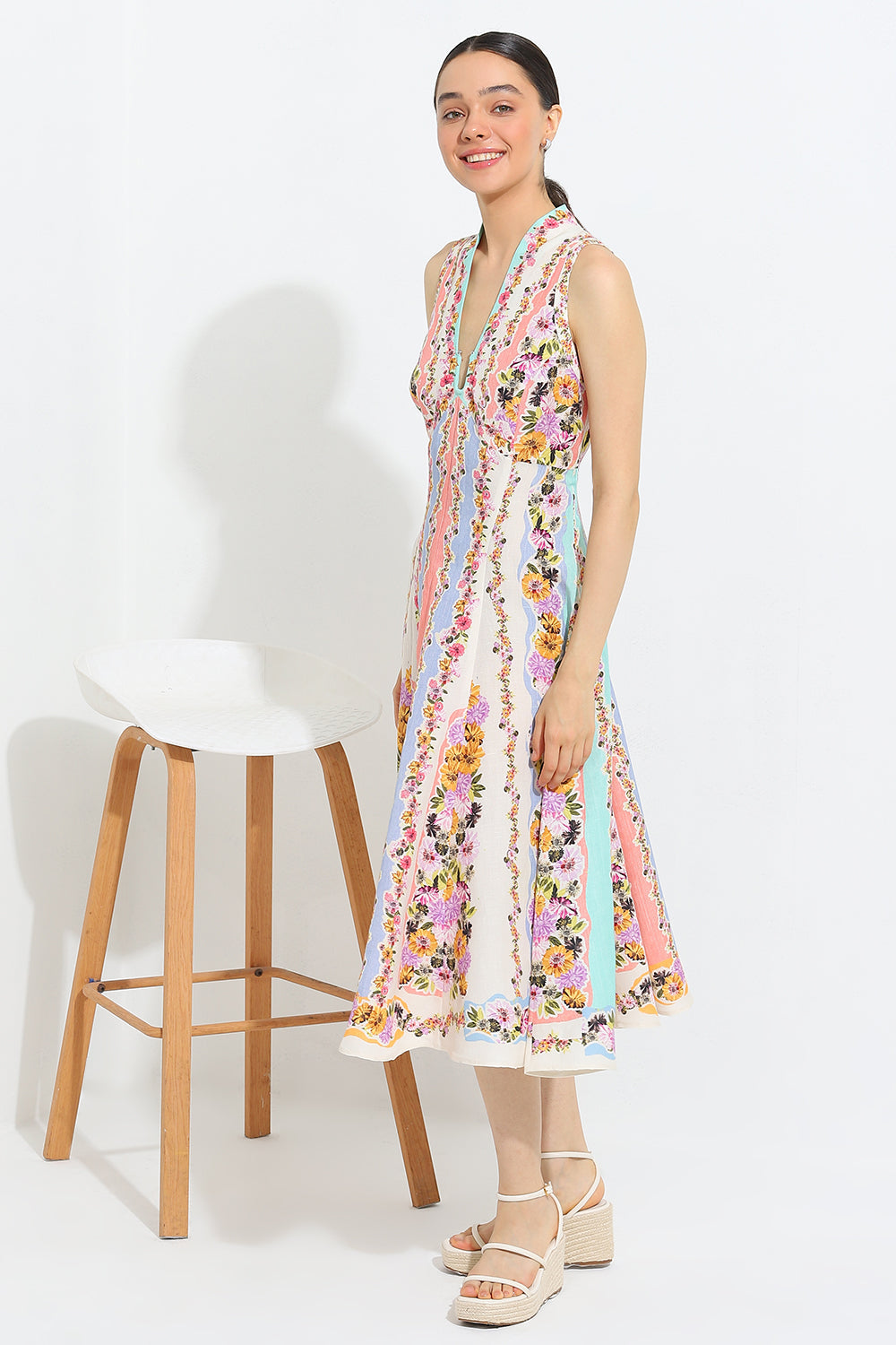 Simran Luthria in Aviva Halter Fit Flare Midi Dress