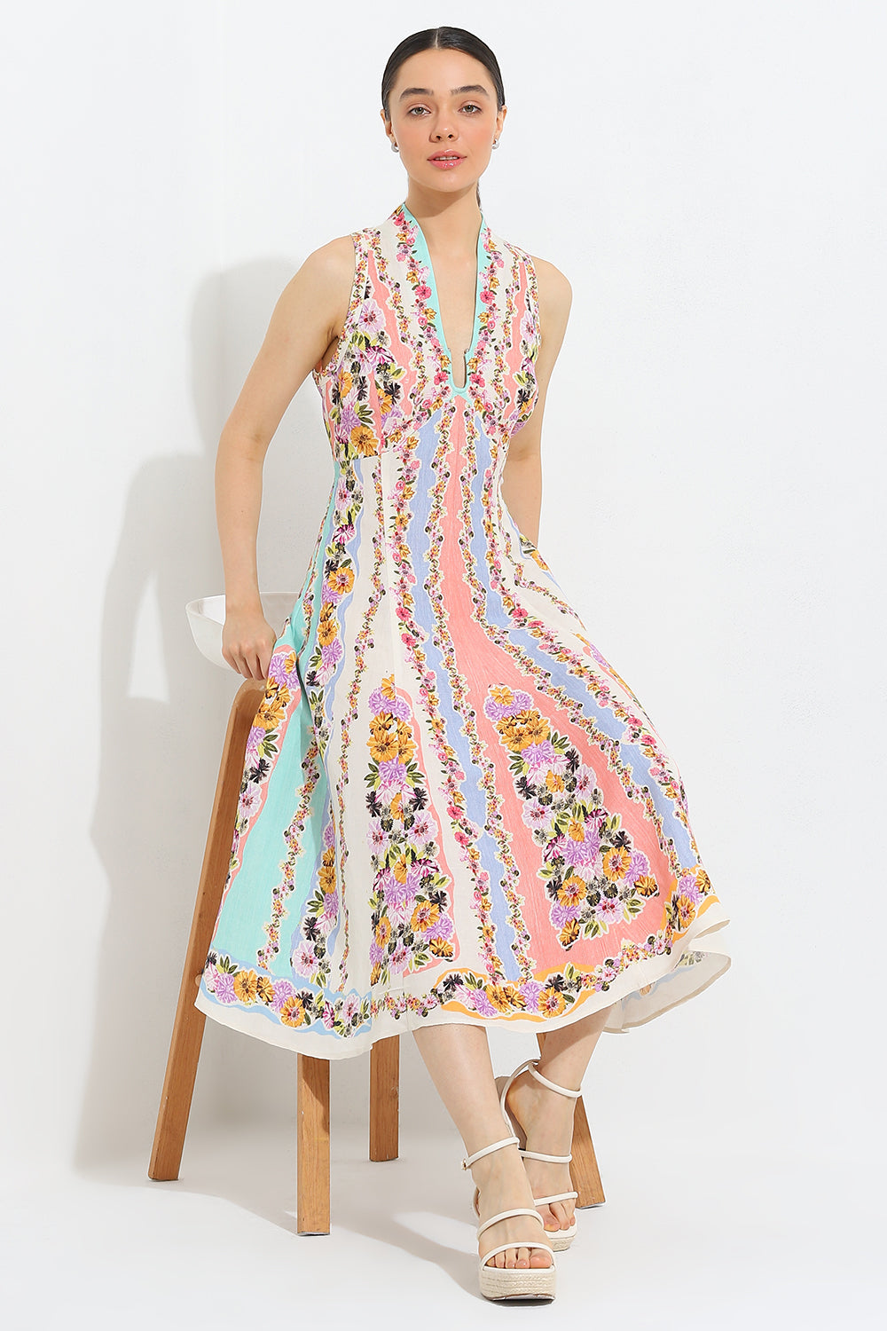 Simran Luthria in Aviva Halter Fit Flare Midi Dress