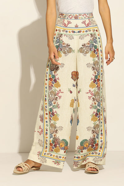 Ivory Wide Leg Pants by ranna gill with a floral and seashell pattern.