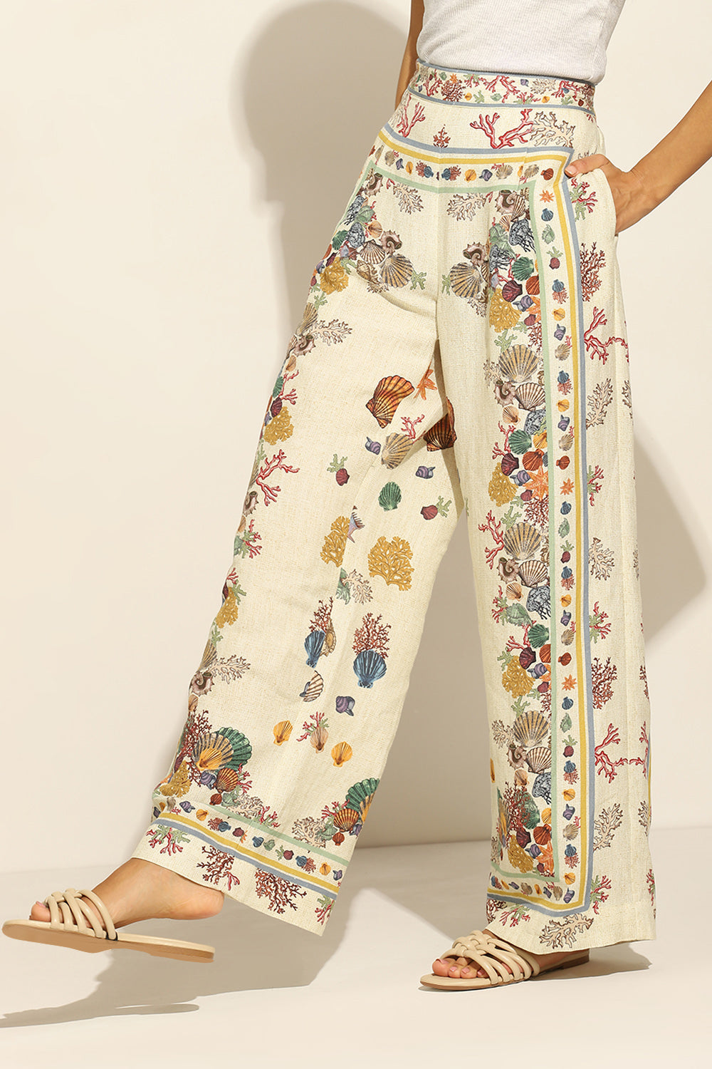 Ivory Wide Leg Pants by ranna gill with a floral and seashell pattern.