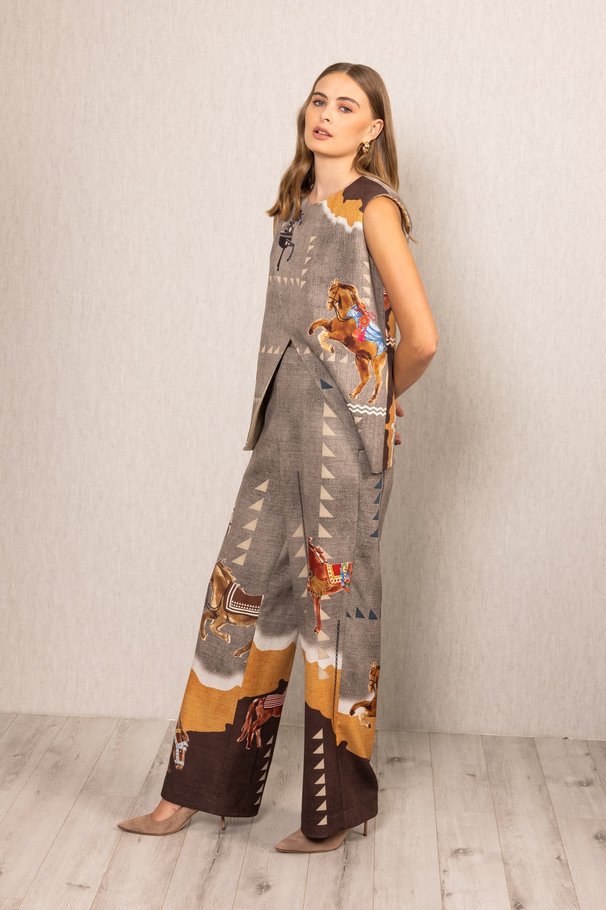 Ranna Gill multicolor Mustang Overlap Blouse with Irish Horse print, sleeveless, round neck and asymmetric front.
