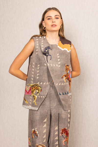Ranna Gill multicolor Mustang Overlap Blouse with Irish Horse print, sleeveless, round neck and asymmetric front.
