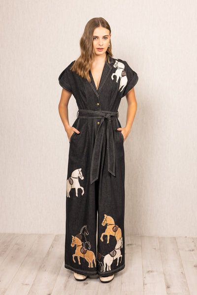 Ranna Gill Phoenix Collared Jumpsuit black denim with horse embroidery, wide-leg silhouette, V-neckline and belted waist

