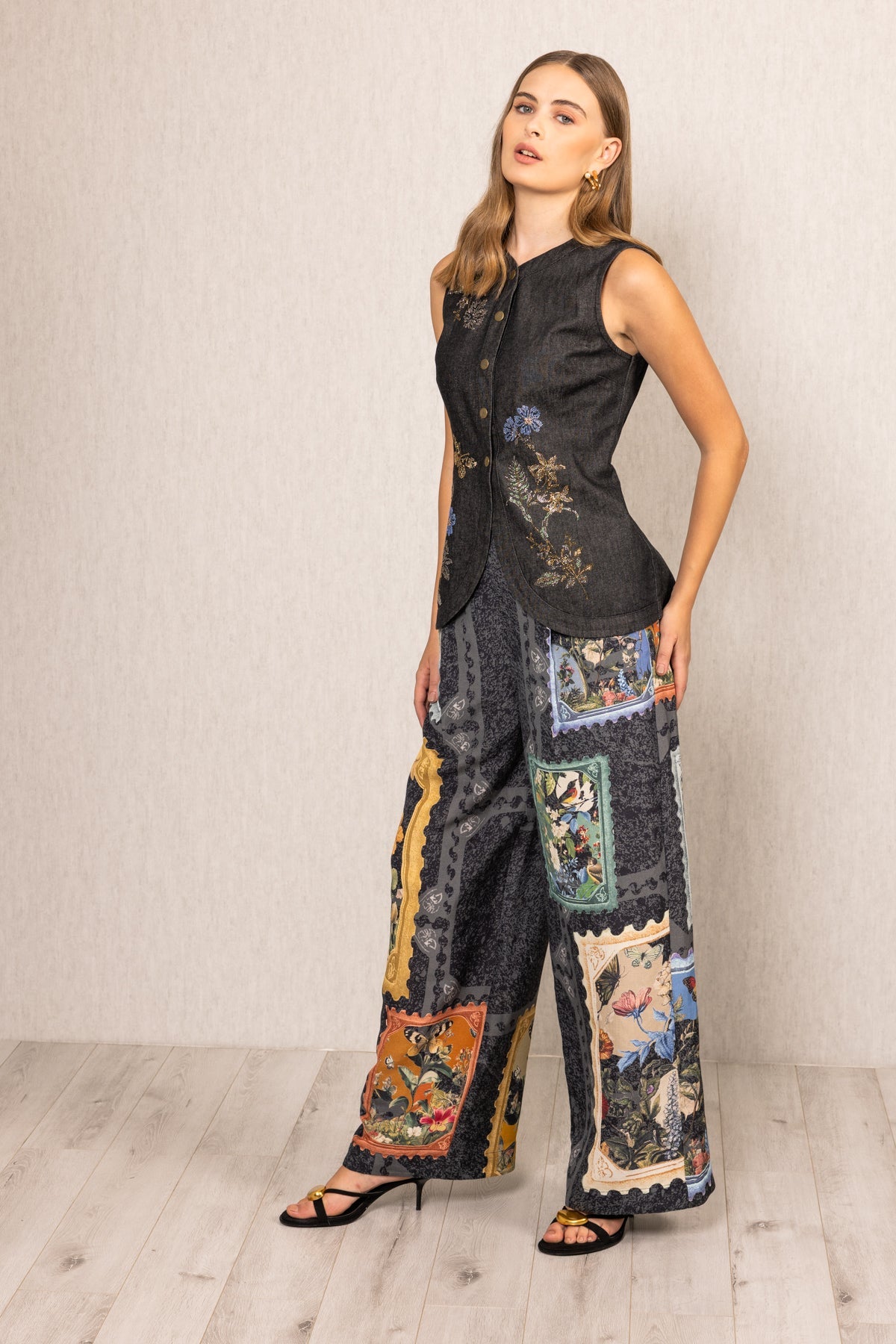 A sleeveless top and wide-leg pants with a patchwork design 