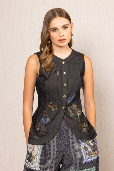 Ranna Gill Aster Sleeveless Waist Coat A dark sleeveless top with floral embroidery