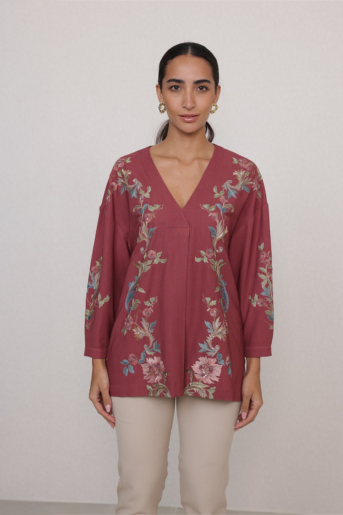 Ranna Gill Amber Blouse in rust red with vine embroidery & V-neckline.
