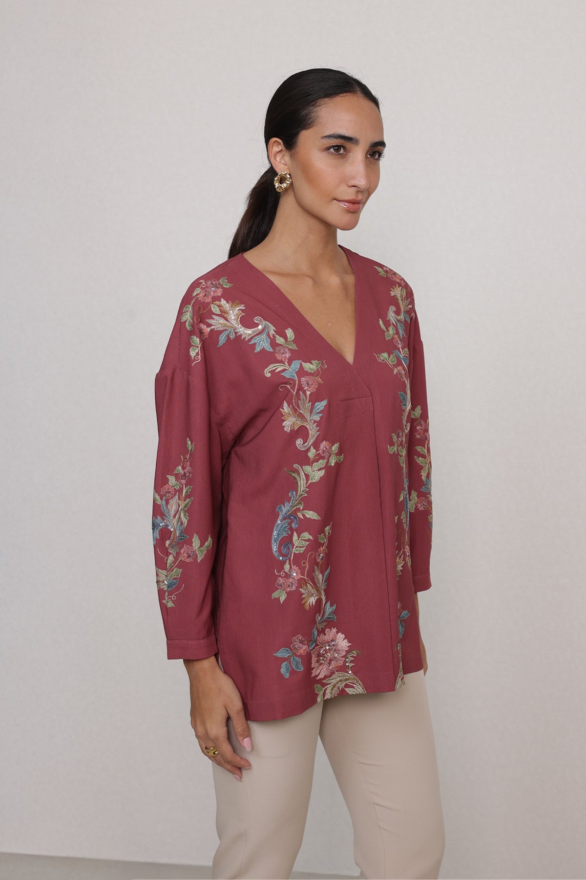 Ranna Gill Amber Blouse in rust red with vine embroidery & V-neckline.