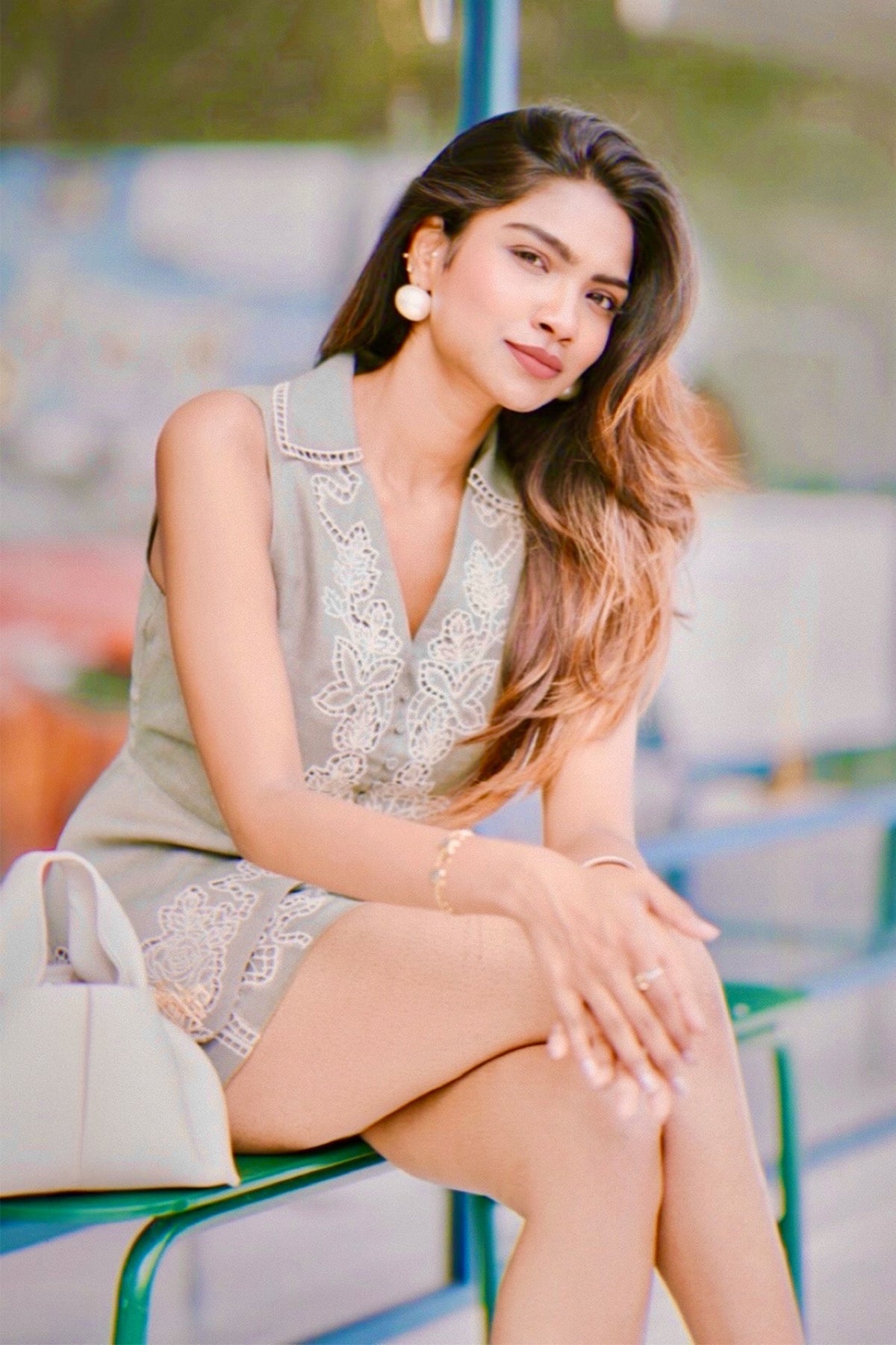 Thanmayee Ramineni in sage green high-waist Eli shorts by Ranna Gill, featuring floral Schiffli embroidery on the hem