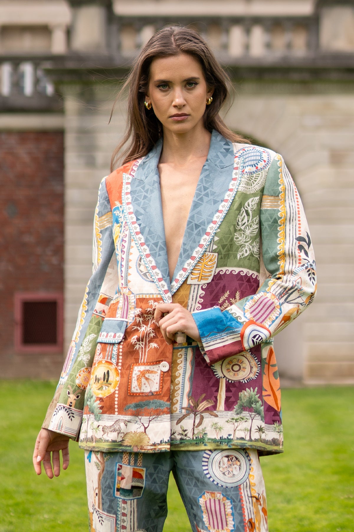 Woman wearing a colorful patchwork jacket outdoors