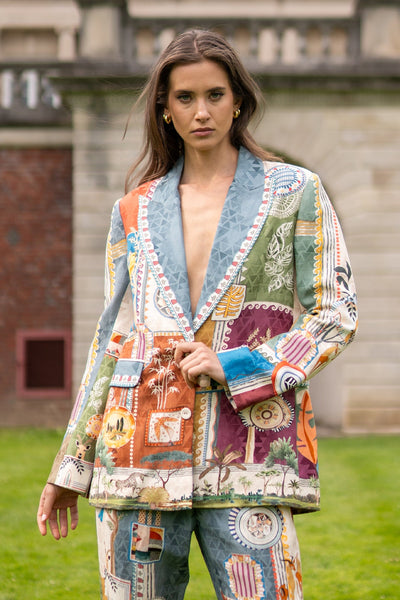 Woman wearing a colorful patchwork jacket outdoors