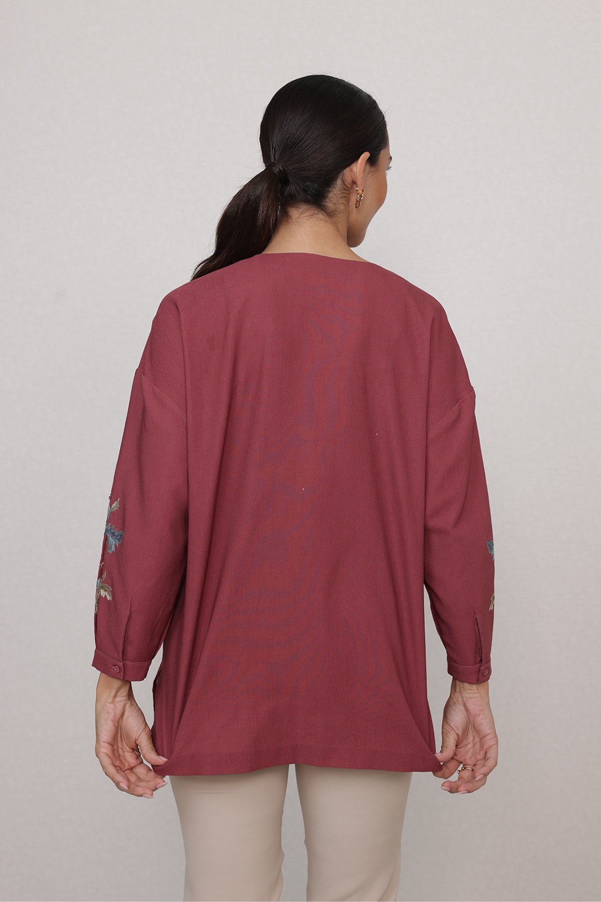 Ranna Gill Amber Blouse in rust red with vine embroidery & V-neckline.