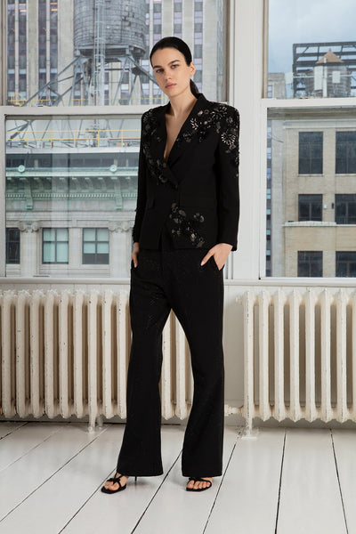 A black crepe blend jacket with long sleeves and a notched lapel collar, paired with trousers.