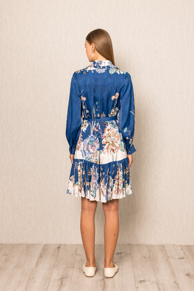 Ranna Gill Bluebell Pleated Dress in viscose satin Navy Blooms print with tiered pleats.