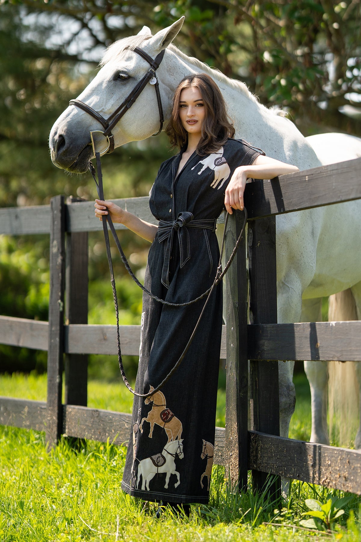 Ranna Gill Phoenix Collared Jumpsuit black denim with horse embroidery, wide-leg silhouette, V-neckline and belted waist