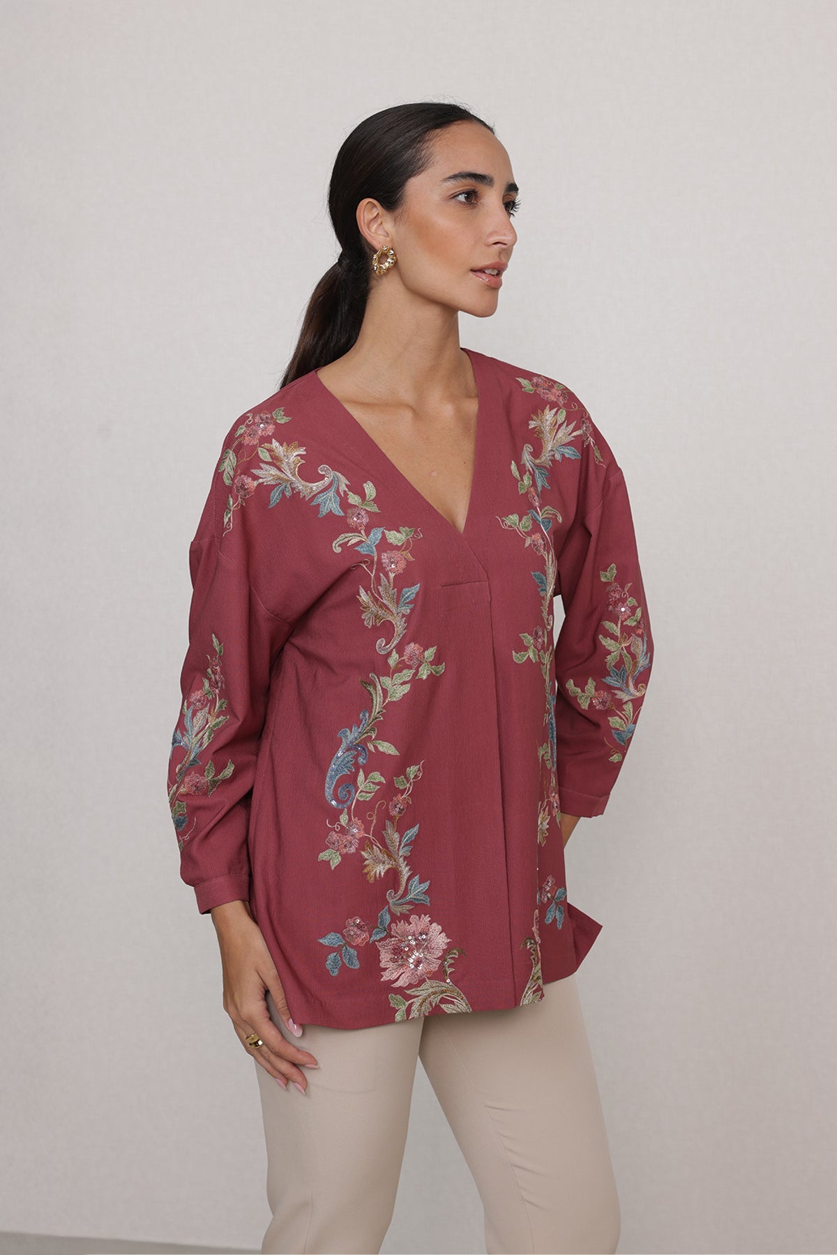 Ranna Gill Amber Blouse in rust red with vine embroidery & V-neckline.