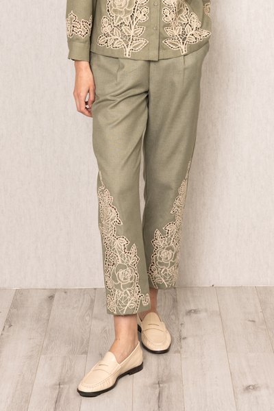 Sage green Raylen Rara Pants in Poly Flex with high waist, tapered legs, and tonal Schiffli embroidery on lower panels