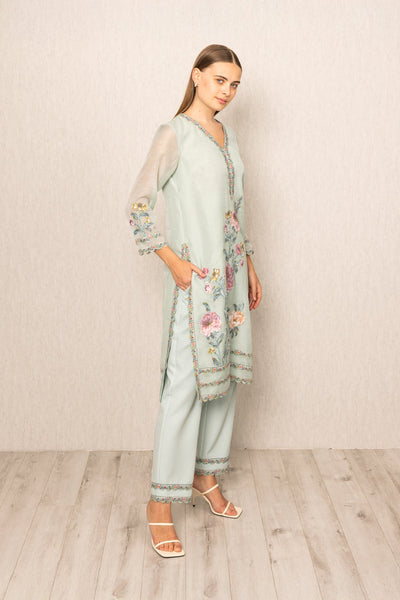 Ranna Gill Oraya Tunic Set in sage green Dhaka Linen with pastel floral embroidery.