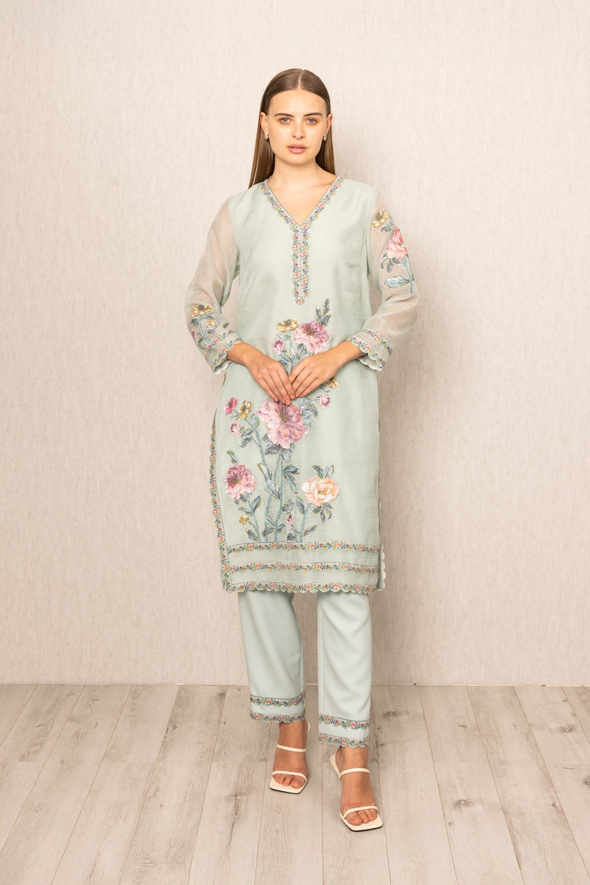 Ranna Gill Oraya Tunic Set in sage green Dhaka Linen with pastel floral embroidery.