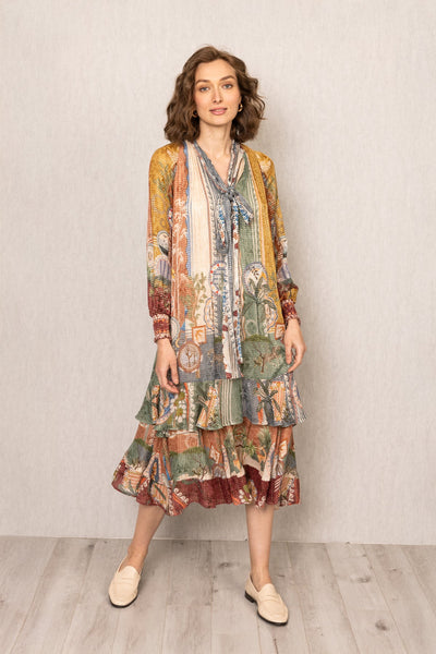 Woman wearing Tula Gathered Midi Dress in multi-color Santa Fe print by Ranna Gill.