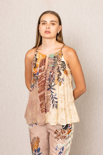 a sleeveless top and pants with floral patterns 