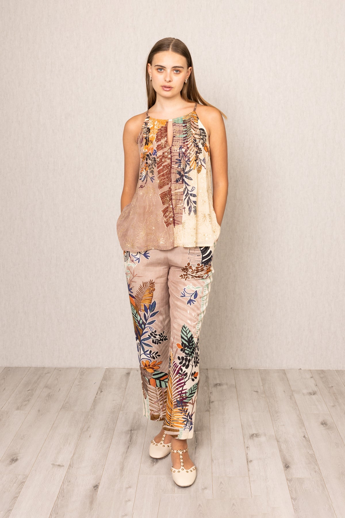 a sleeveless top and pants with floral patterns 