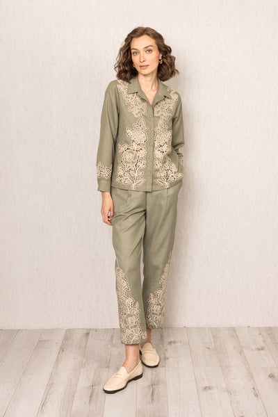 Sage green Raylen Rara Pants in Poly Flex with high waist, tapered legs, and tonal Schiffli embroidery on lower panels
