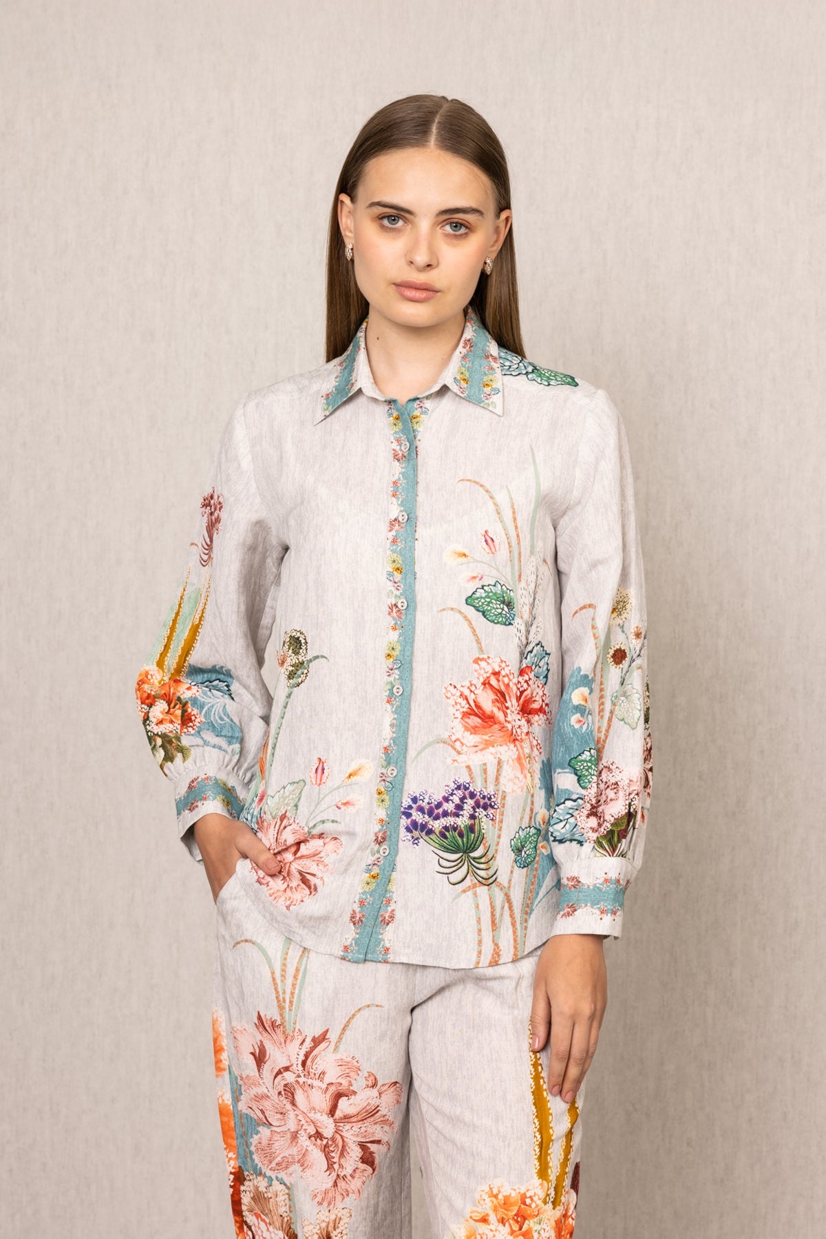 Ranna Gill Bora Co-ord Set in White linen with Floral buttondown shirt and tailored pants.