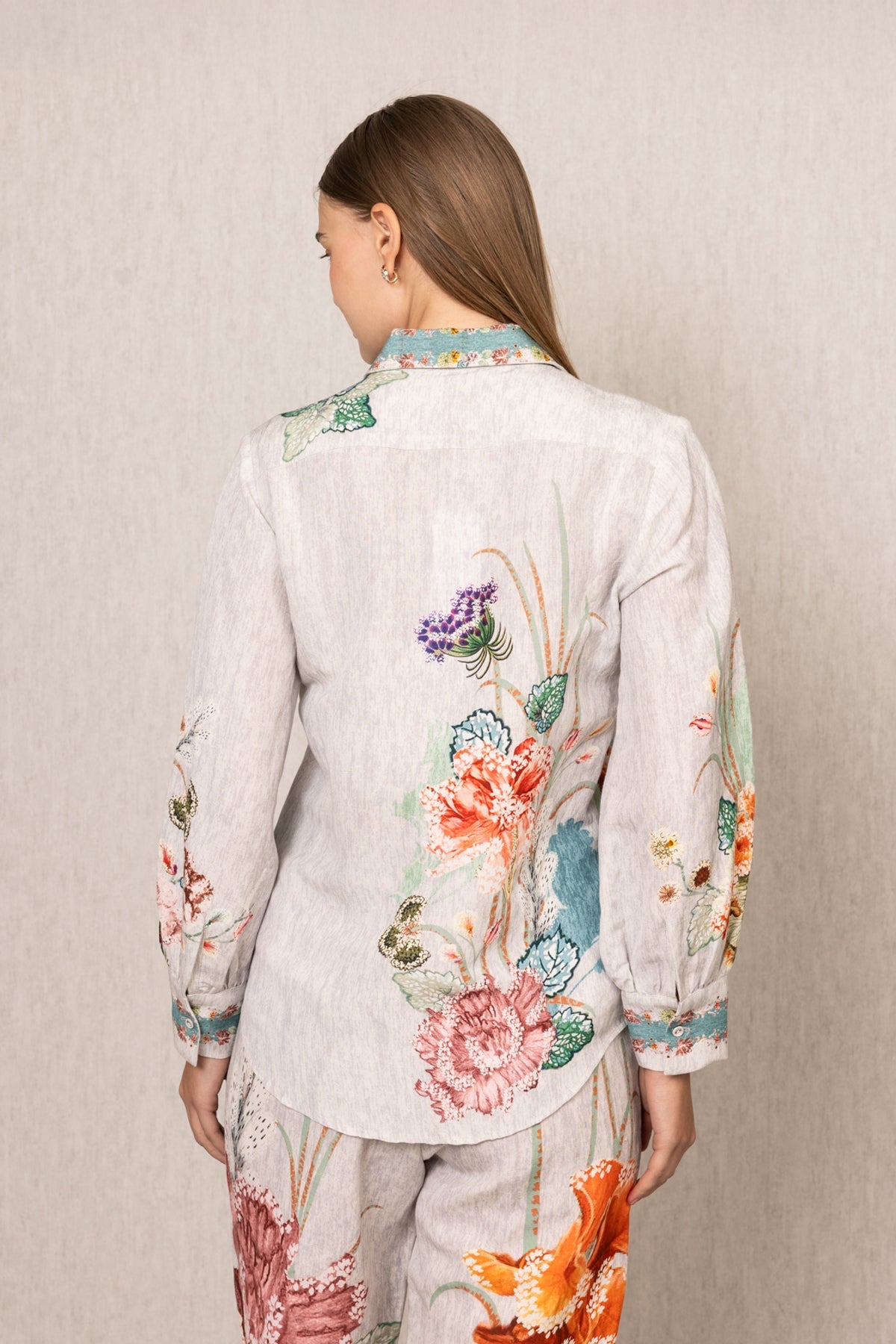 Ranna Gill Bora Co-ord Set in White linen with Floral buttondown shirt and tailored pants.