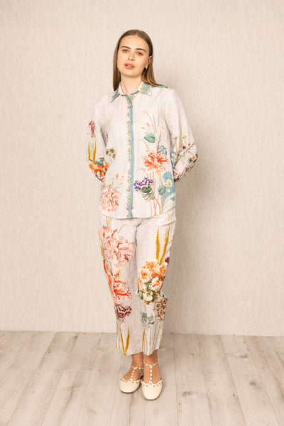 Ranna Gill Bora Co-ord Set in White linen with Floral buttondown shirt and tailored pants.