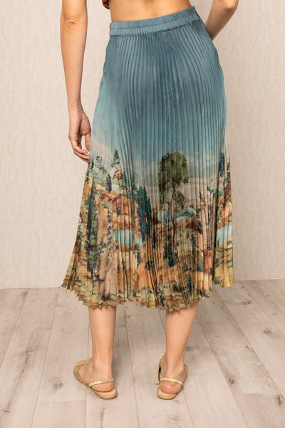Ranna Gill Lyon Pleated Skirt in teal blue satin with Tuscany print and precision pleats.