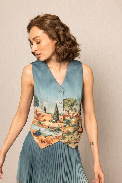 Ranna Gill Ibiza Waist Coat in teal blue satin with Tuscany print and button-down front.