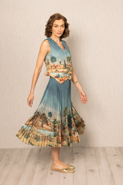 Ranna Gill Lyon Pleated Skirt in teal blue satin with Tuscany print and precision pleats.