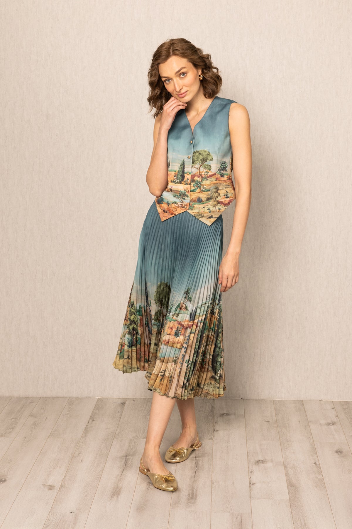 Ranna Gill Ibiza Waist Coat in teal blue satin with Tuscany print and button-down front.