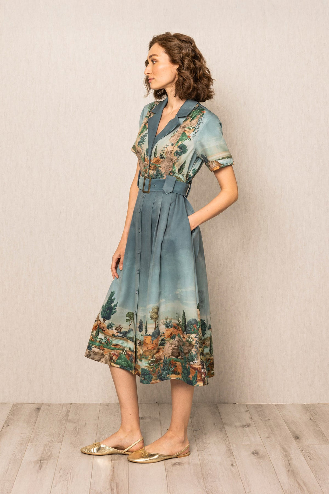 Woman wearing a floral dress with a neutral background