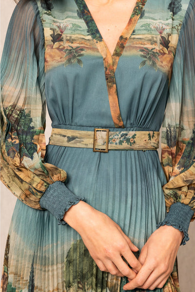Blue dress with floral patterned sleeves and belt, overlayed with a classical painting.