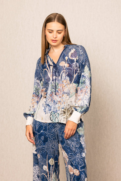 Ranna Gill Ibiza Blouse & Pant Set in Navy Blooms Floral print with tie-up blouse & wide-leg pants.