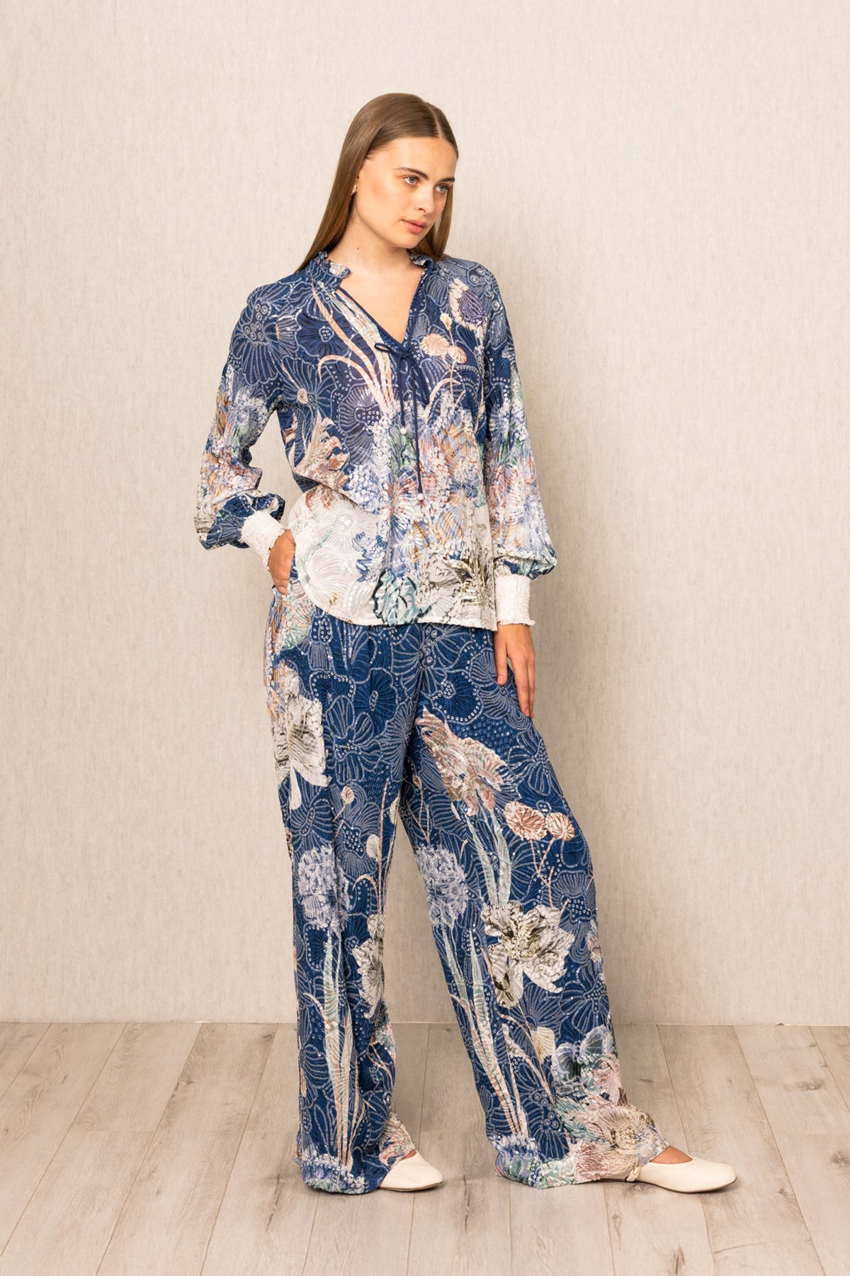 Ranna Gill Ibiza Blouse & Pant Set in Navy Blooms Floral print with tie-up blouse & wide-leg pants.