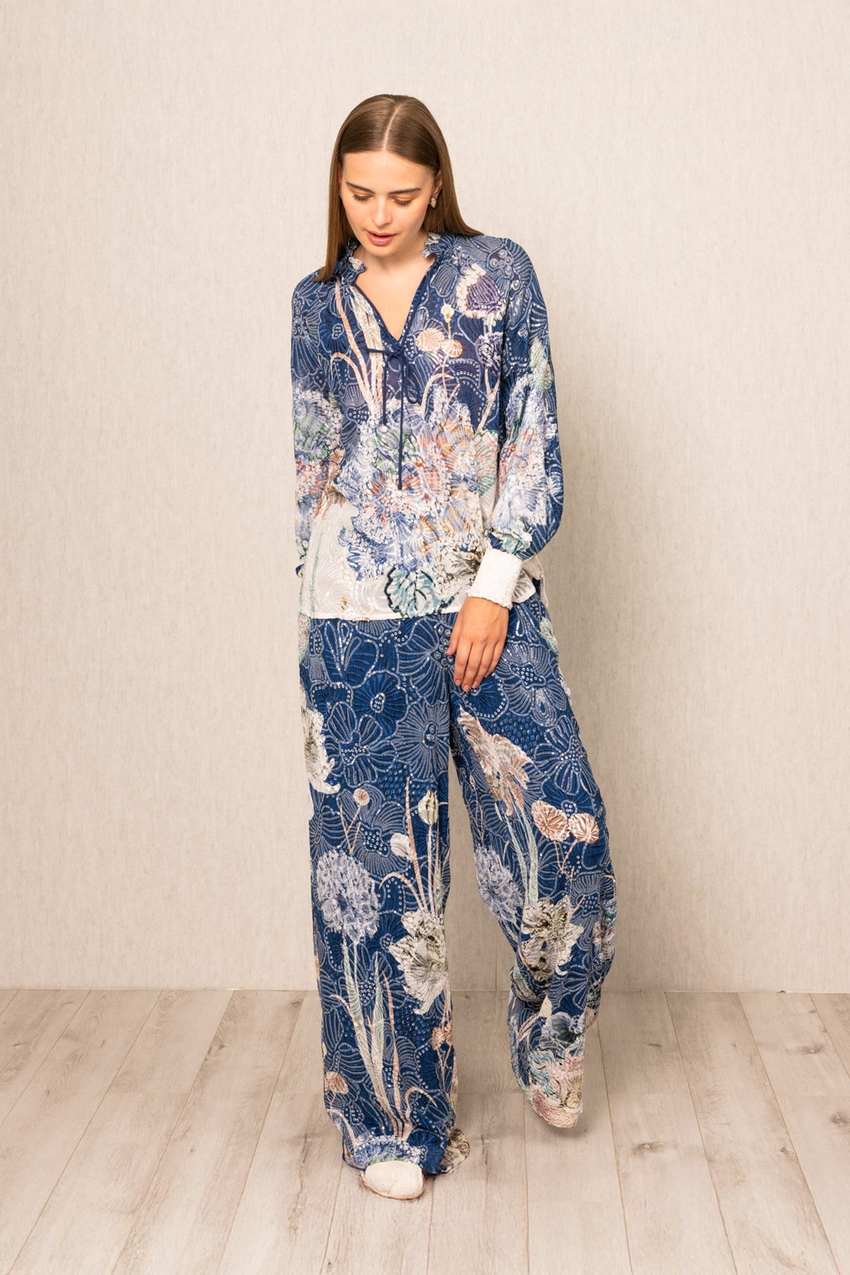 Ranna Gill Ibiza Blouse & Pant Set in Navy Blooms Floral print with tie-up blouse & wide-leg pants.