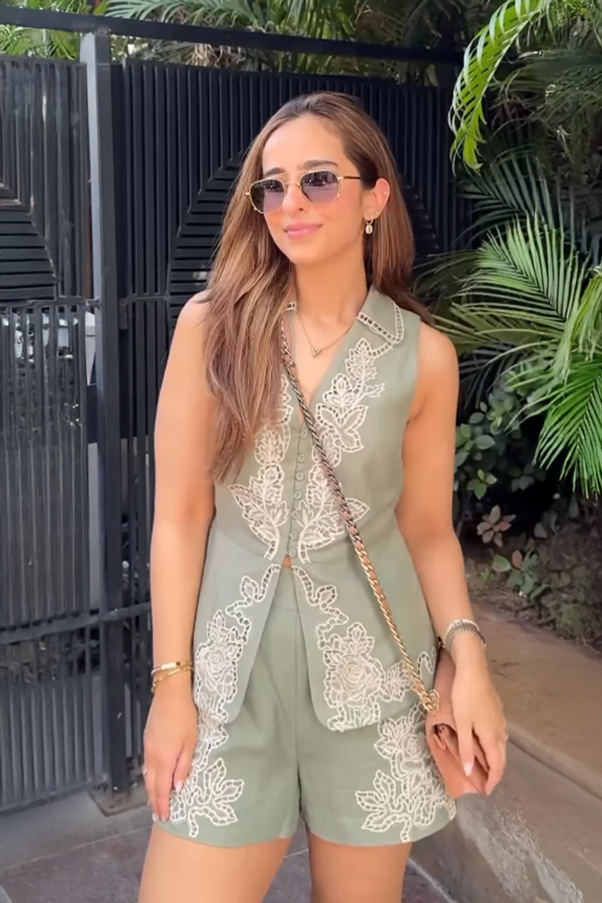 Thanmayee Ramineni in sage green high-waist Eli shorts by Ranna Gill, featuring floral Schiffli embroidery on the hem