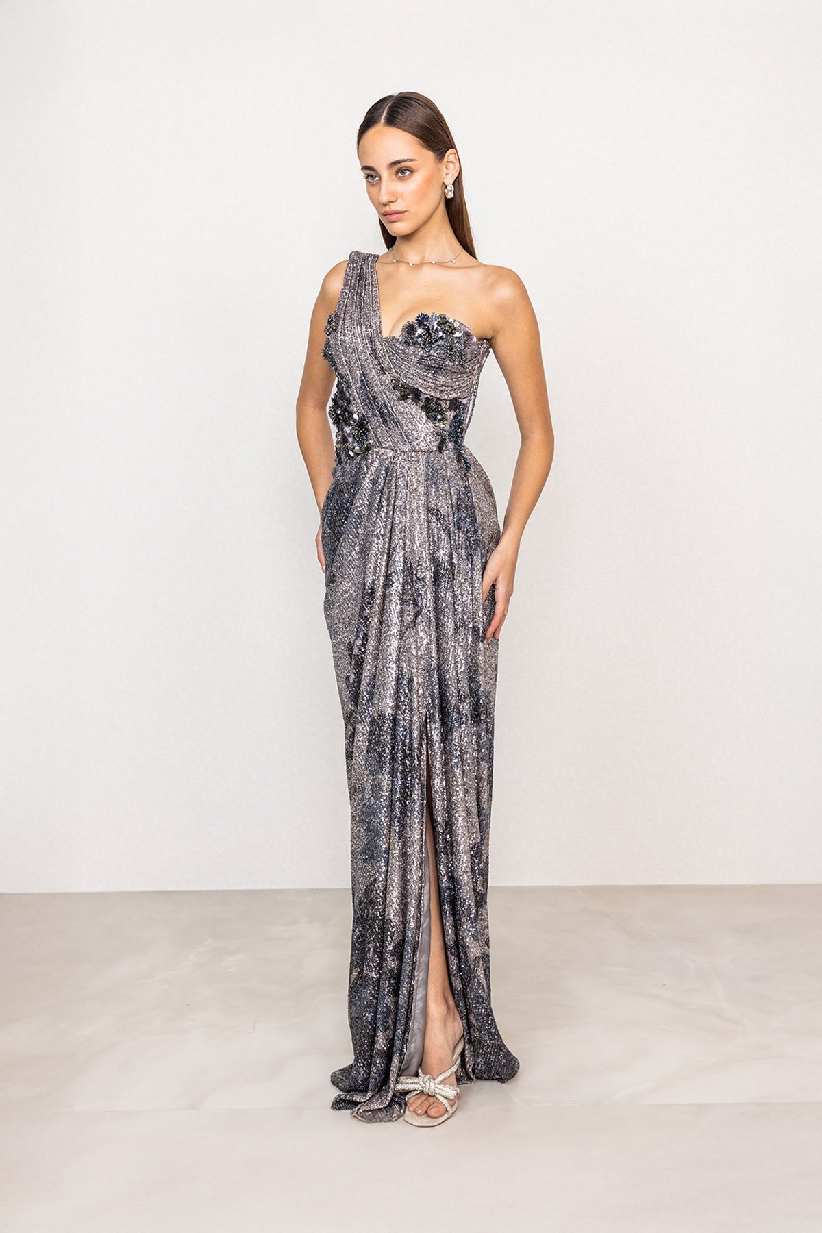 Ranna Gill Emberline Grey One Shoulder Floral Sequin Drape Gown.