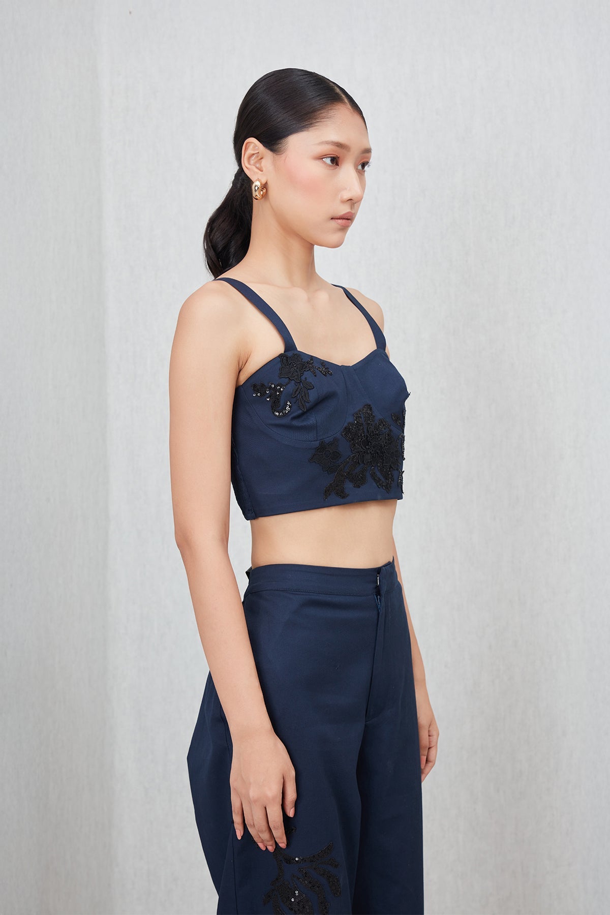Ranna Gill Tammie Bustier in navy blue cotton twill with tonal floral applique and sequins.