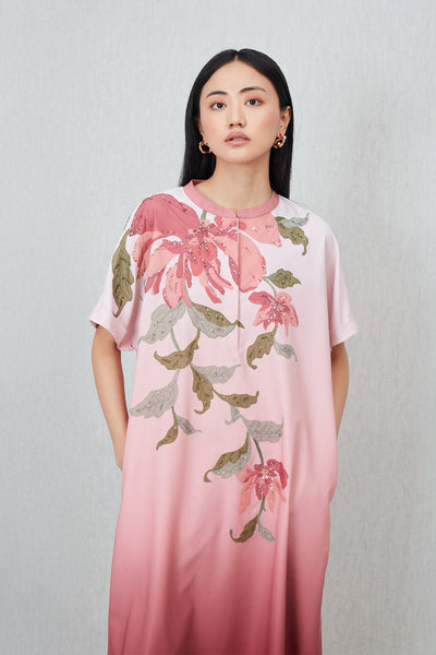 Woman wearing a pink floral dress 