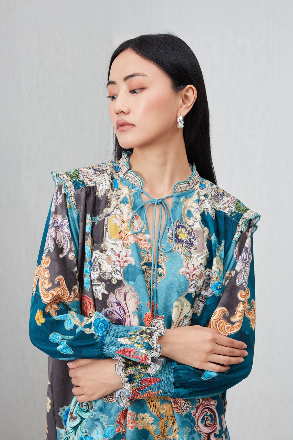 Ranna Gill Venari Neck Tie Blouse in Poly Crinkle Baroque print with tie-up neckline and gathered cuffs.