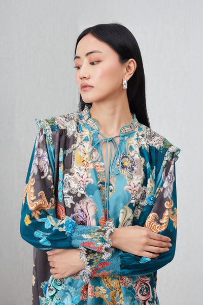 Ranna Gill Venari Neck Tie Blouse in Poly Crinkle Baroque print with tie-up neckline and gathered cuffs.