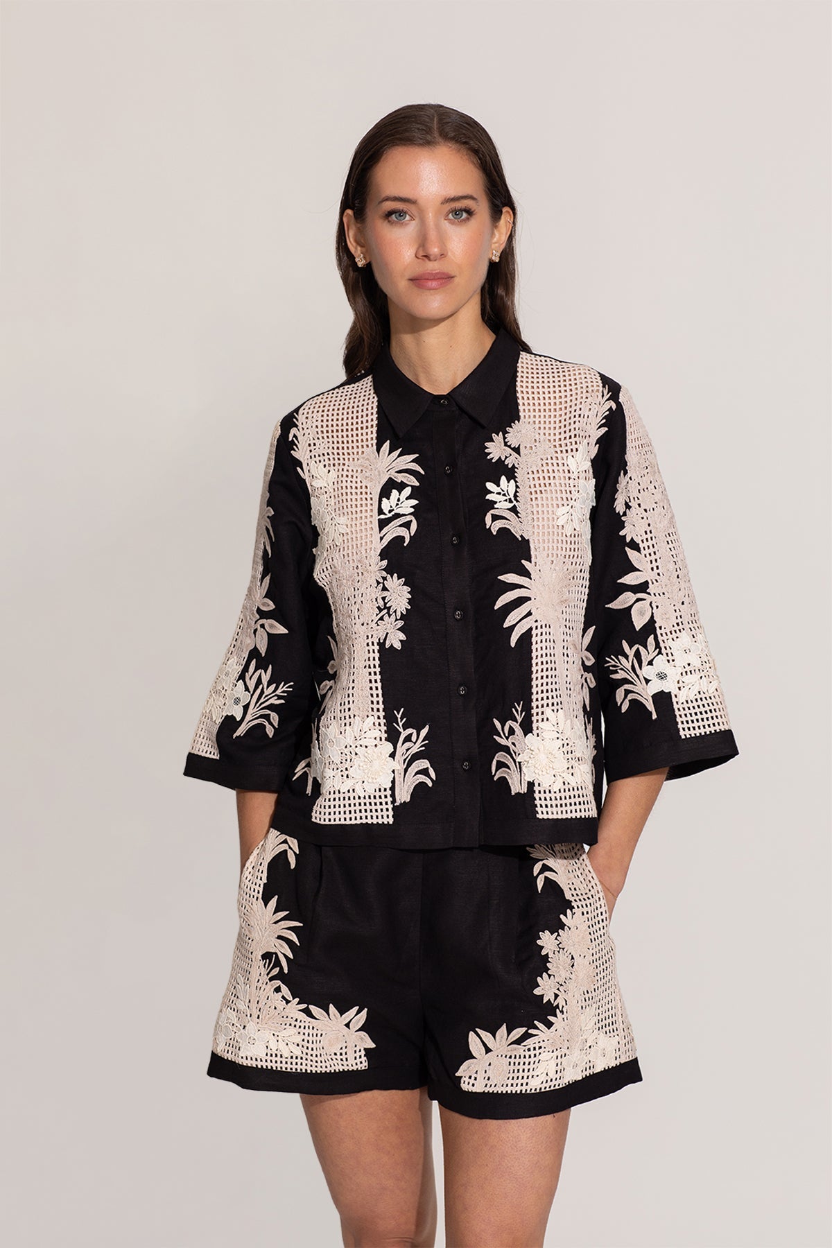 Ranna Gill Alice black relaxed-fit shirt with ivory floral embroidery.