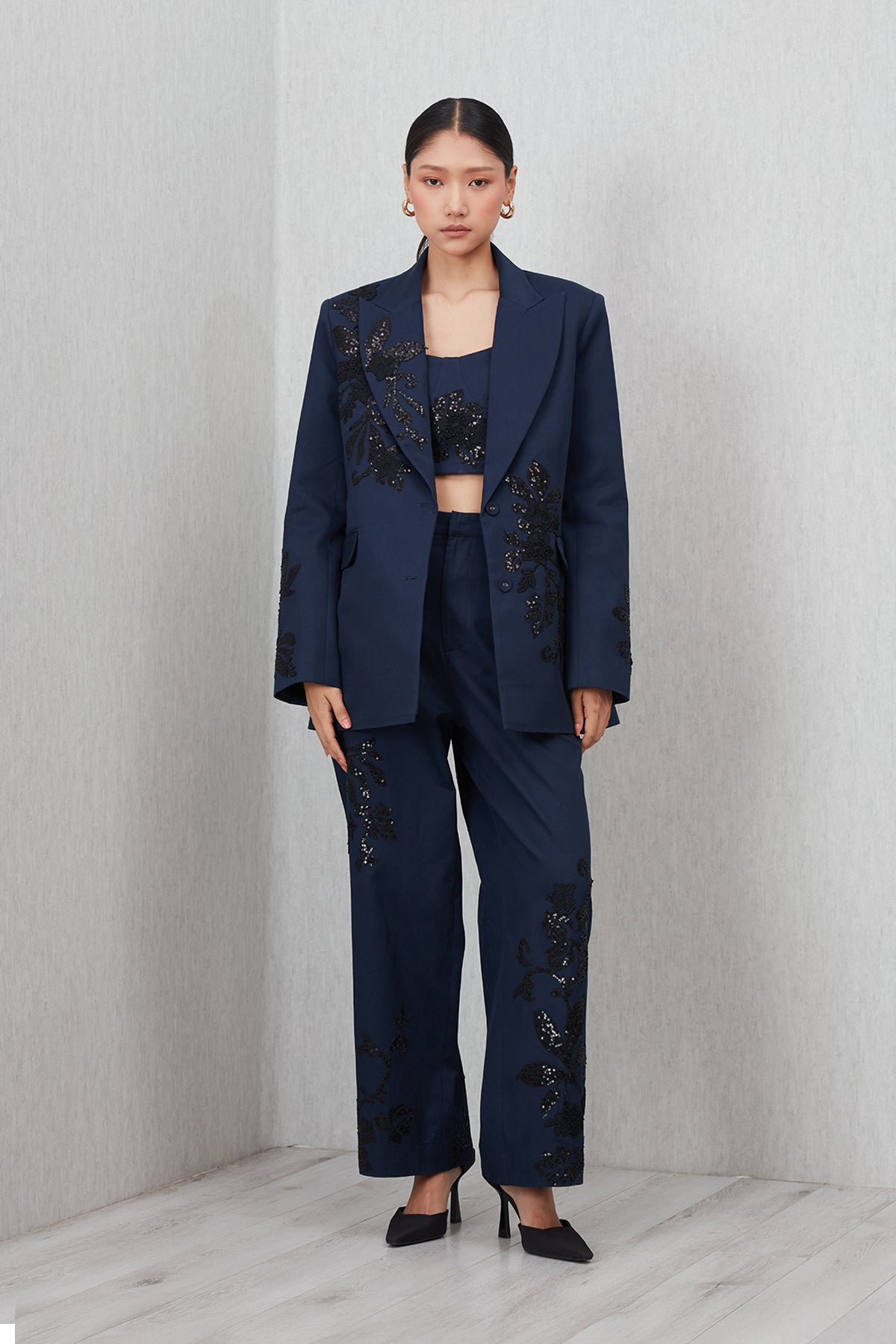Ranna Gill Amara Oversized Jacket in navy blue cotton twill with Black floral sequin embroidery.
