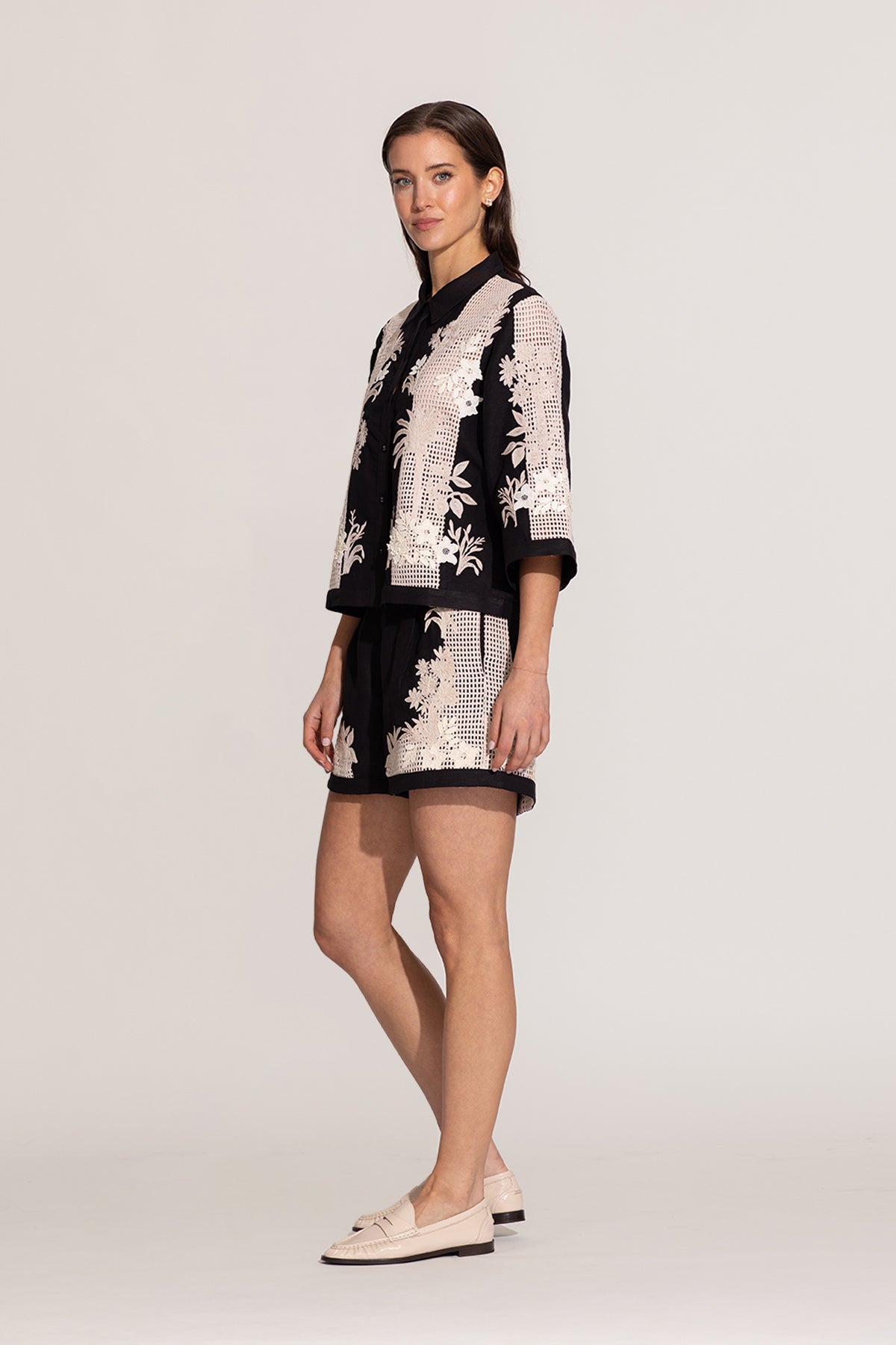 Ranna Gill Alice black relaxed-fit shirt with ivory floral embroidery.