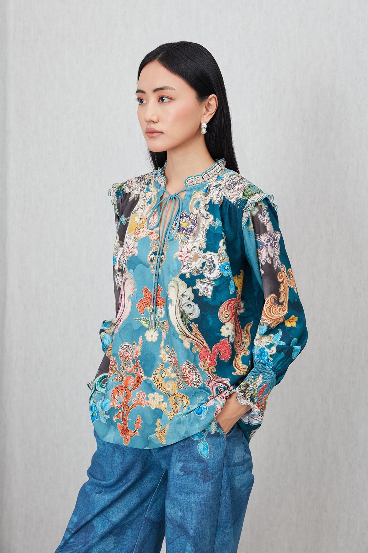 Ranna Gill Venari Neck Tie Blouse in Poly Crinkle Baroque print with tie-up neckline and gathered cuffs.