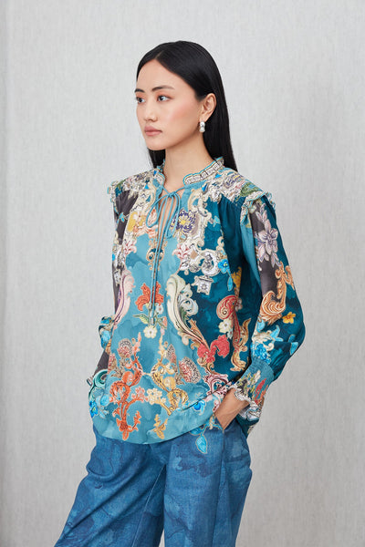 Ranna Gill Venari Neck Tie Blouse in Poly Crinkle Baroque print with tie-up neckline and gathered cuffs.