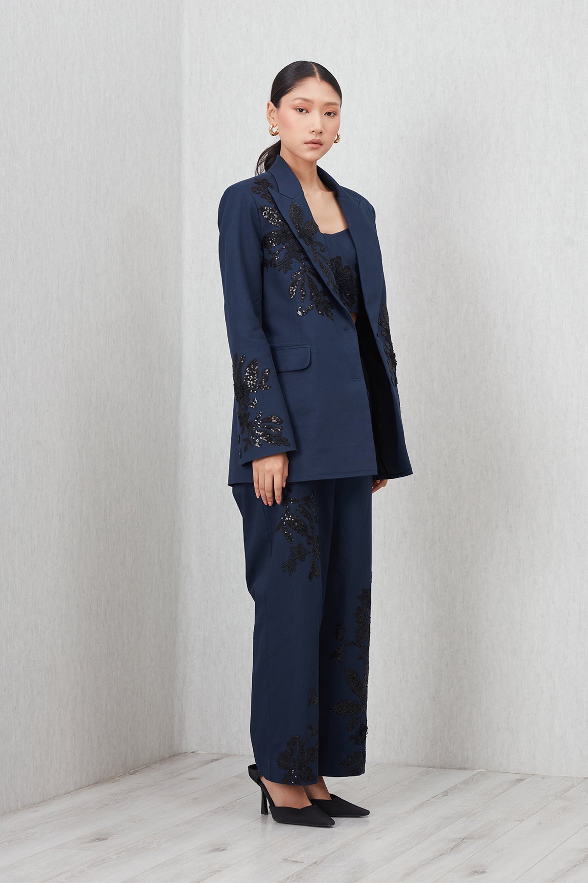 Ranna Gill Amara Oversized Jacket in navy blue cotton twill with Black floral sequin embroidery.